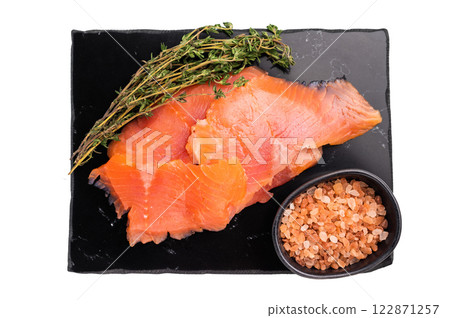 Salty salmon, trout fillet slices with herbs isolated on white background. top view 122871257
