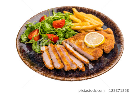 Fried Weiner schnitzel steak, pork breaded fillet meat with french fry and salad isolated on white background Fried Weiner schnitzel steak, pork breaded fillet meat with french fry and salad isolated on white background 122871268