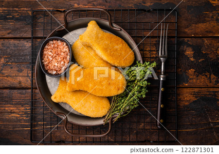 Fish fingers or fish sticks on steel tray. wooden background. top view 122871301
