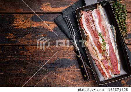 Smoked duck pastrami meat slices. wooden background. top view 122871368