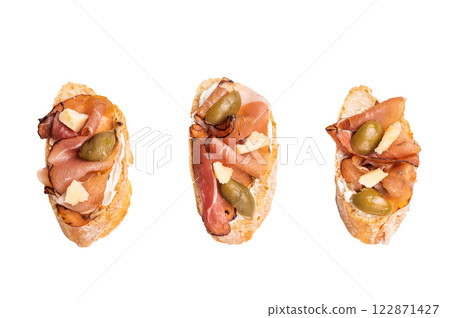Bruschetta with Prosciutto ham, parmesan cheese and olives isolated on white background. top view 122871427