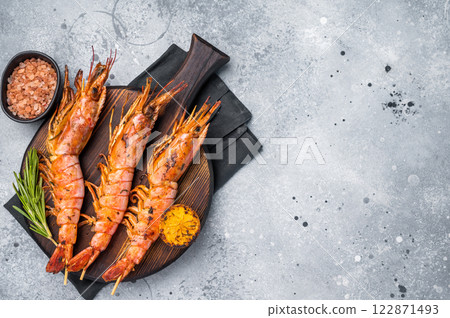 Seafood Skewers with Grilled red Argentine shrimps, Prawns Langostino Austral. grey background. top view 122871493