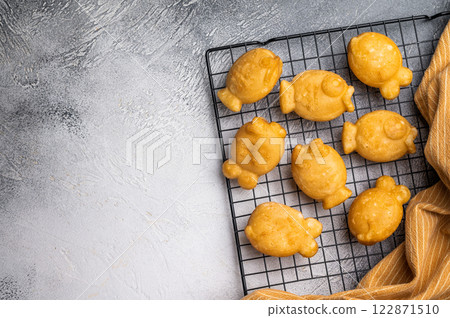 Korean pancake Bungeoppang, Fish shaped Waffle with sweet red bean filling. white background. top view Korean pancake Bungeoppang, Fish shaped Waffle with sweet red bean filling. white background. top view 122871510