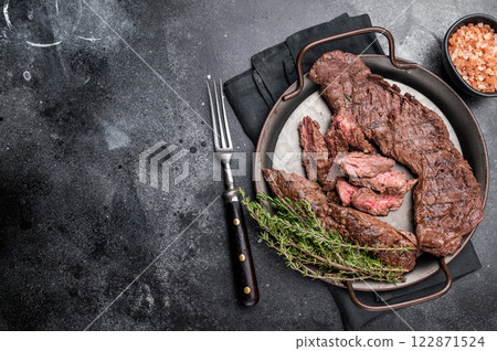 Grilled Beef Machete Skirt Steak, prime meat. black background. top view 122871524