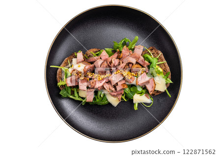 Toast with duck breast meat, foie gra, arugula and cheese on plate isolated on white background. top view Toast with duck breast meat, foie gra, arugula and cheese on plate isolated on white background. top view 122871562