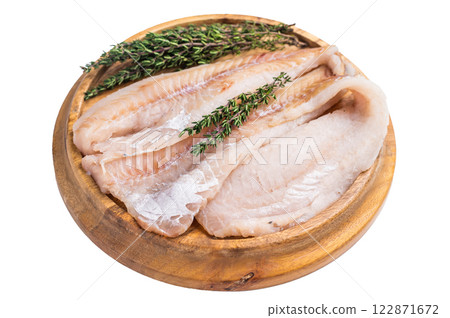 Fresh Raw Hake fish fillets, whitefish meat on a wooden board with herbs isolated on white background. top view 122871672