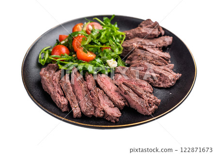 Grilled Beef Denver strip Steak on a plate with salad isolated on white background. top view 122871673