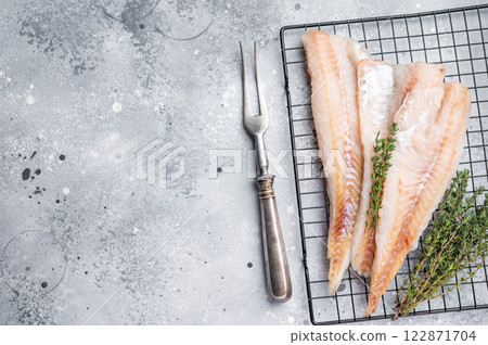 Raw pollock white fish fillet with thyme. grey background. top view 122871704