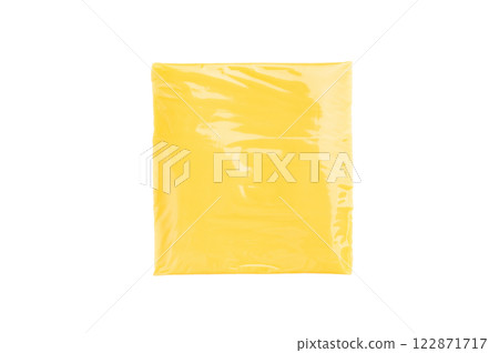Square Slices of processed Cheddar cheese in individual plastic packaging isolated on white background Square Slices of processed Cheddar cheese in individual plastic packaging isolated on white background 122871717