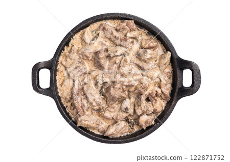 Mushroom beef stroganoff in a skillet isolated on white background. top view 122871752