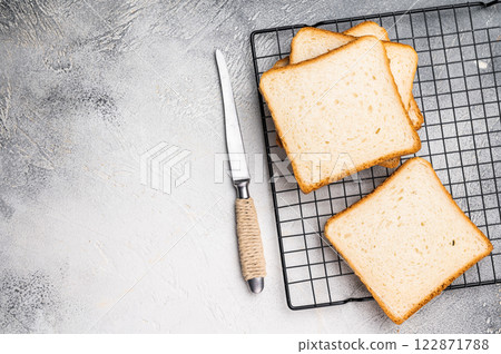 Square Slices of loaf wheat bread for toasts. white background. top view 122871788