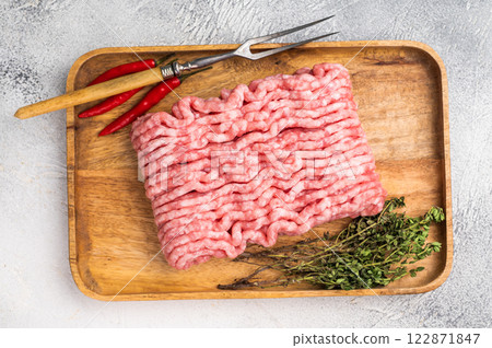 Uncooked mince veal and pork meat, raw forcemeat. white background. top view Uncooked mince veal and pork meat, raw forcemeat. white background. top view 122871847