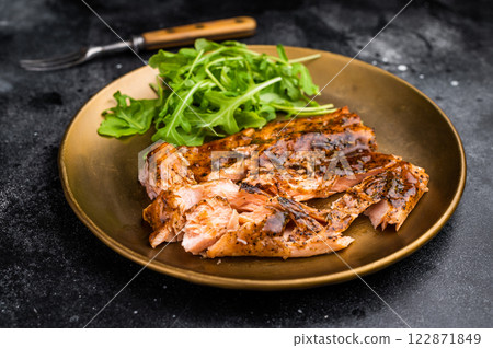 Teriyaki salmon fillet steak with salad on a plate. black background. top view 122871849