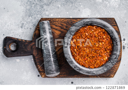 Cooking of Red Chili pepper and paprika flakes. grey background. top view 122871869