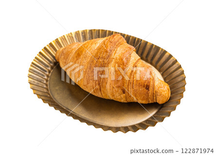 Freshly baked single brown French croissant on metal plate isolated on white background. 122871974
