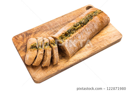 Garlic bread with herbs on wooden cutting board isolated on white background Garlic bread with herbs on wooden cutting board isolated on white background 122871980