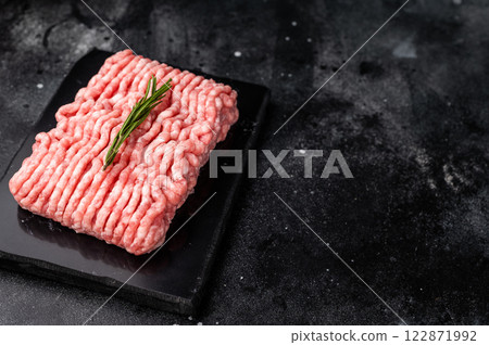 Raw ground pork meat, mincemeat. black background. top view 122871992