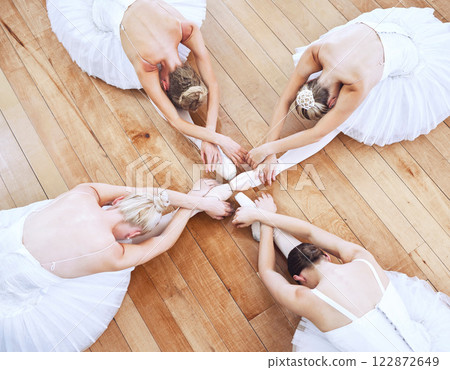Ballet dancers, art performance and women dancing in classic style sitting during practice, training and exercise in dance studio. Group of ballerina girls with passion for fitness in hall from above 122872649
