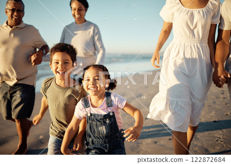 Happy family, beach vacation and children running during fun active activity in summer with parents and grandparents. Laughing, bonding and chasing joy while men, women and kids playing on holiday Happy family, beach vacation and children running during fun active activity in summer with parents and grandparents. Laughing, bonding and chasing joy while men, women and kids playing on holiday 122872684