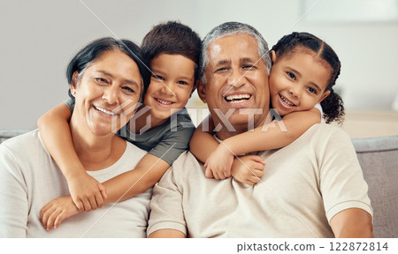 Grandparents, grandkids and hug portrait of family relax, love and care on lounge sofa at home. Smile, play and happy children, senior grandma and funny elderly grandpa bond together for quality time Grandparents, grandkids and hug portrait of family relax, love and care on lounge sofa at home. Smile, play and happy children, senior grandma and funny elderly grandpa bond together for quality time 122872814