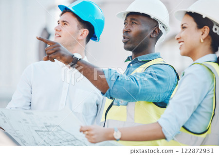 Architect at construction site, discussion on blueprint or plan for building with staff. Team of employees of architecture company, with helmet working on strategy for real estate project or property 122872931
