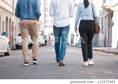 Friends, walking and city with a woman and men on a walk together outside in the city. Friendship, commute and travel with a friend group outdoor in town for exploration and sightseeing in the day 122872943