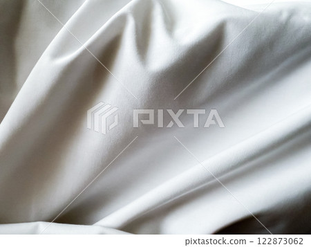 Close up texture on white blanket, The blanket is wrinkled. Close up texture on white blanket, The blanket is wrinkled. 122873062