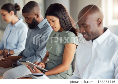 Corporate seminar and tablet for business notes for company workplace training audience. Employees at workshop with focus and concentration writing in notebook or typing on digital tech. 122873146