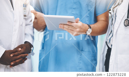 Teamwork, healthcare and doctors planning on digital tablet, sharing advice and checking online schedule in a hospital. Communication, strategy and innovation closeup of health experts sharing vision Teamwork, healthcare and doctors planning on digital tablet, sharing advice and checking online schedule in a hospital. Communication, strategy and innovation closeup of health experts sharing vision 122873228