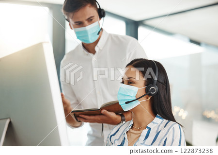 Covid, face mask and call center woman training intern on customer service computer, contact us and crm consulting office. Virus compliance, receptionist teamwork or learning consultant collaboration Covid, face mask and call center woman training intern on customer service computer, contact us and crm consulting office. Virus compliance, receptionist teamwork or learning consultant collaboration 122873238