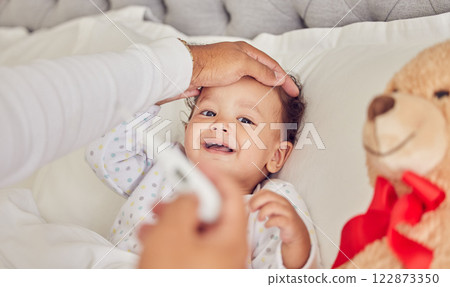 Baby, sick and fever with a mother checking the temperature of a girl lying in bed at home. Family, healthcare and medicine with a daughter feeling ill or unwell and resting in the bedroom of a house Baby, sick and fever with a mother checking the temperature of a girl lying in bed at home. Family, healthcare and medicine with a daughter feeling ill or unwell and resting in the bedroom of a house 122873350