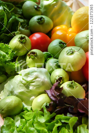Variety of fresh vegetables in a wooden box. 122873365