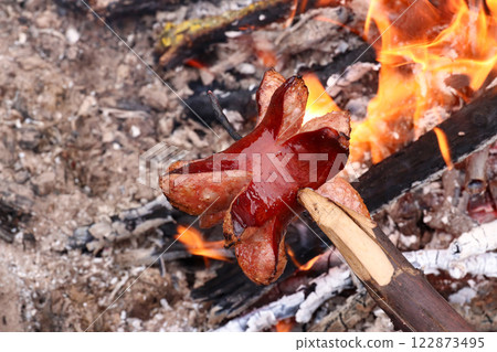 Pork sausage roasted over the cam fire 122873495