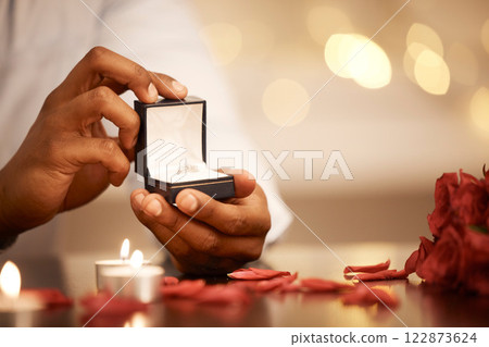 Engagement, jewellery and proposal with wedding ring for gift, celebration or announcement during romantic date. Save the date, love or present with diamond jewelry for commitment or surprise 122873624