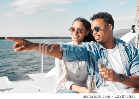 Boat, yacht and couple with champagne in the summer sun and sea to celebrate love together. Happy smile of people by ocean water, blue waves and sunshine in nature for a anniversary celebration 122873635