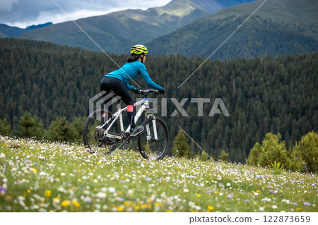 Riding mountain bike on beautiful forest mountain top 122873659
