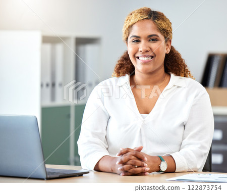 Black woman portrait, happy business entrepreneur and smile employee at desk in modern office startup. Young african american female professional worker with career motivation, vision and happiness Black woman portrait, happy business entrepreneur and smile employee at desk in modern office startup. Young african american female professional worker with career motivation, vision and happiness 122873754