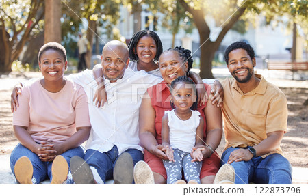 Happy portrait of a black family in nature with mother, grandparents and children smiling next to father. Mom, dad and kids love quality time with senior African woman at a park in summer on holiday Happy portrait of a black family in nature with mother, grandparents and children smiling next to father. Mom, dad and kids love quality time with senior African woman at a park in summer on holiday 122873796