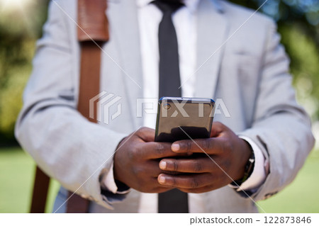 African accountant businessman hands with phone on social media or reading news on corporate finance and success strategy. Black management employee of digital technology and network mobile company African accountant businessman hands with phone on social media or reading news on corporate finance and success strategy. Black management employee of digital technology and network mobile company 122873846