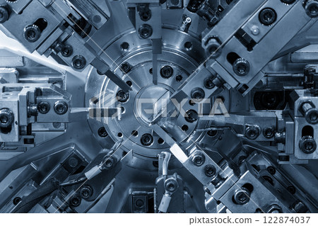 Close up the coil spring machine in light blue scene. 122874037