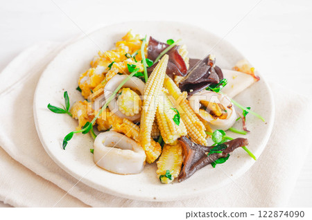Stir-fried spear squid and young corn with oyster sauce Stir-fried spear squid and young corn with oyster sauce 122874090
