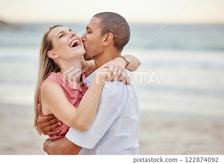 Beach couple love, hug and kiss for summer vacation, happy marriage and lifestyle together. Laughing woman, playful man and interracial relationship enjoying ocean travel, holiday break and happiness Beach couple love, hug and kiss for summer vacation, happy marriage and lifestyle together. Laughing woman, playful man and interracial relationship enjoying ocean travel, holiday break and happiness 122874092