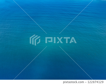 Aerial view of blue sea surface Aerial view of blue sea surface 122874129