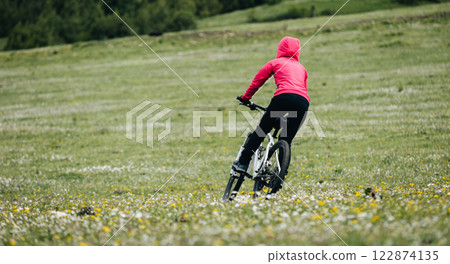 Riding mountain bike in the beautiful mountains Riding mountain bike in the beautiful mountains 122874135