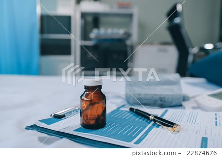 stethoscope on a report stethoscope on a clipboard stethoscope on a book 122874676
