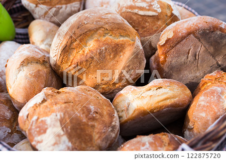 Ruddy rolls of fresh warm grain bread Ruddy rolls of fresh warm grain bread 122875720