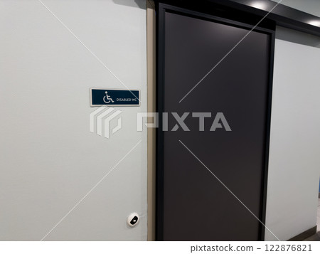 Entrance to toilet with sliding door for wheelchair users 122876821