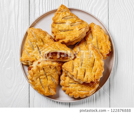 puff pastry apple turnovers on a plate 122876888