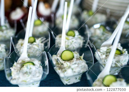 Snacks for the holiday, catering. Various snacks. Assortment of salads and buffet dishes. Meat, fish, cheese, salads, fruits and vegetables, sauces and canapes for celebrating a festive event. Snacks for the holiday, catering. Various snacks. Assortment of salads and buffet dishes. Meat, fish, cheese, salads, fruits and vegetables, sauces and canapes for celebrating a festive event. 122877030