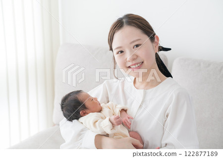 Baby family hugged by mom and sleeping 122877189